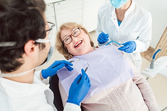 Senior woman smiling in a dental chair