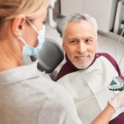 A dentist taking a patient’s dental impressions