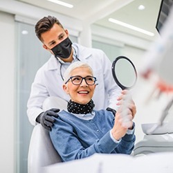 a patient smiling after receiving All on 4 implants