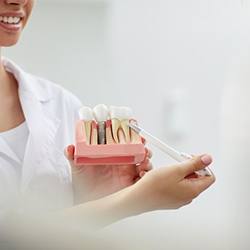 a dentist explaining how dental implants work