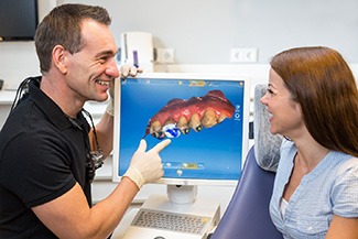 milling unit creating a customized dental crown from a piece of ceramic