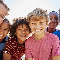 Smiling kids and pre-teens after seeing a children’s dentist in Melbourne