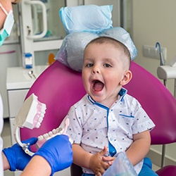 A toddler getting their first checkup with a children’s dentist 
