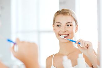 woman brushing her teeth