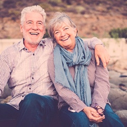 Older couple with dentures in Viera smiling outside