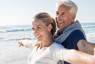 Couple smiling with dental implants in Viera