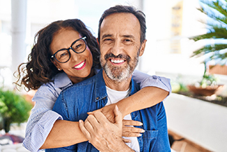 Couple smiling with dental implants in Viera