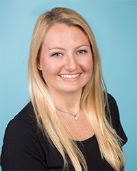 Female with light eyes smiling