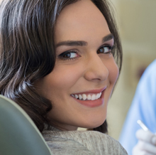 Smiling woman at dentist