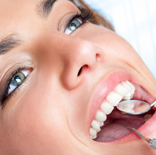 Relaxed woman receiving dental care
