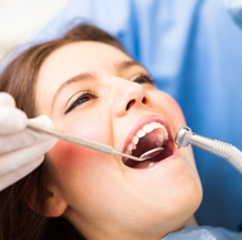 Woman smiling during dental exam