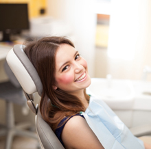 Smiling woman in dental chair