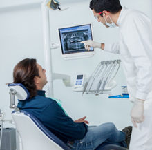 Man looking at dental x-rays