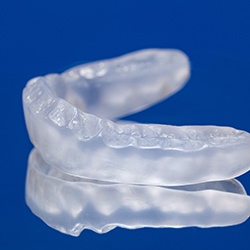 Occlusal splint on a blue background
