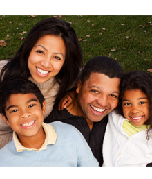 Family smiling outdoors