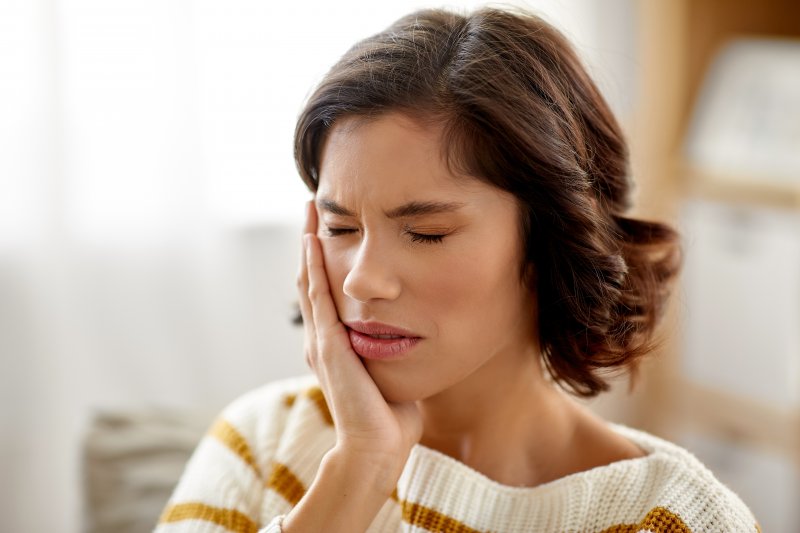 Closeup of woman experiencing tooth pain