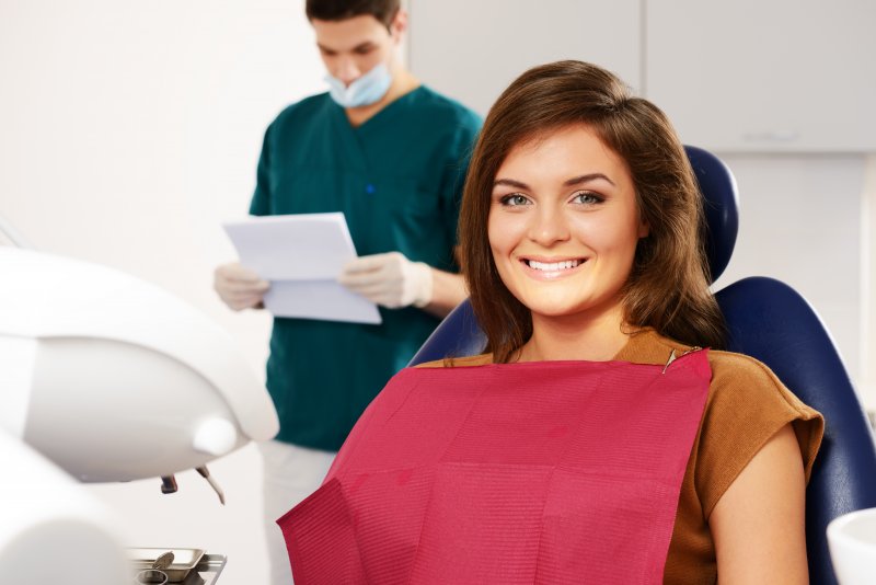 woman using dental insurance to visit dentist