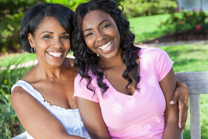 mother and daughter display healthy smiles