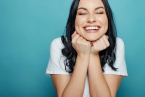 Woman smiling and enjoying several health benefits.