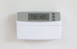 thermostat that reads “too hot” 