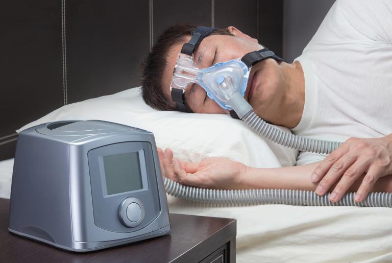 someone wearing a CPAP machine