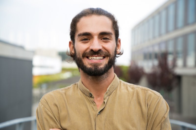 Patient smiling with their dental implants