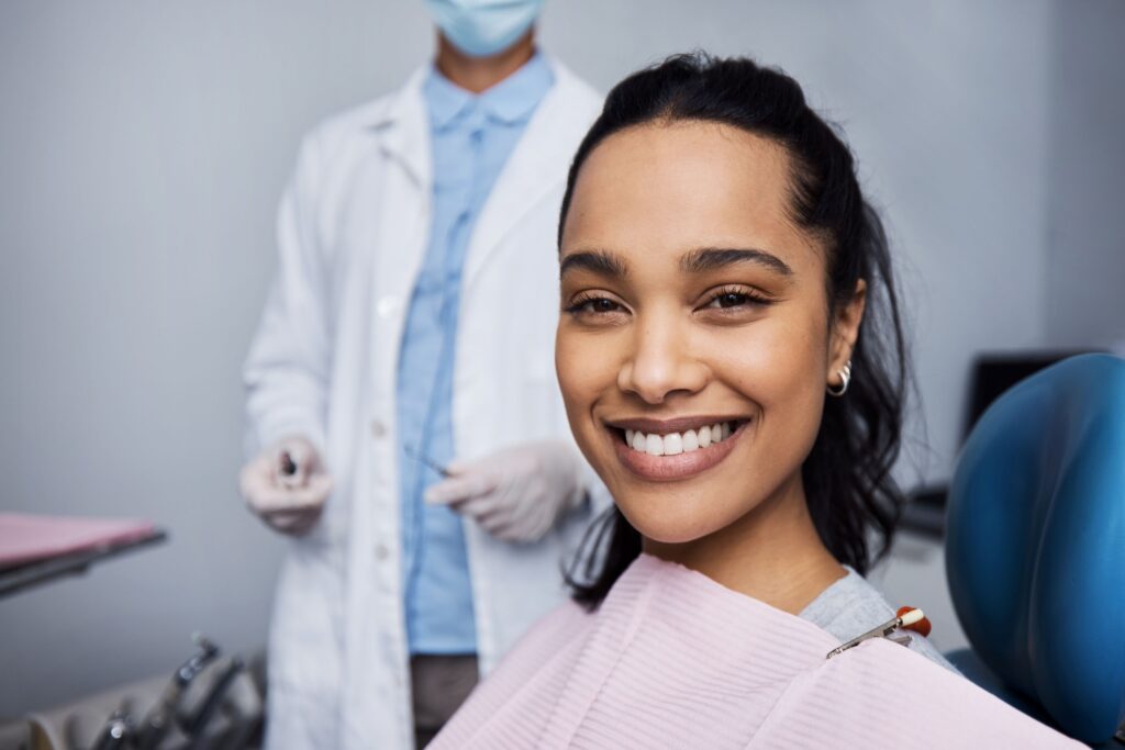 Woman in dental chair smiling 